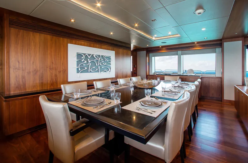 Slide: The Image of Luxurious dining area on a 2014 Sunseeker 131 yacht with elegant table settings. - 13