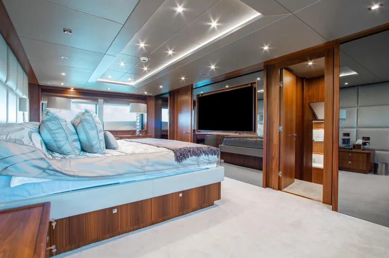 Slide: The Image of Luxurious dining area on a 2014 Sunseeker 131 yacht with elegant table setting. - 14