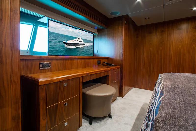 Slide: The Image of Luxurious bedroom on a 2014 Sunseeker 131 yacht with modern wood paneling. - 21