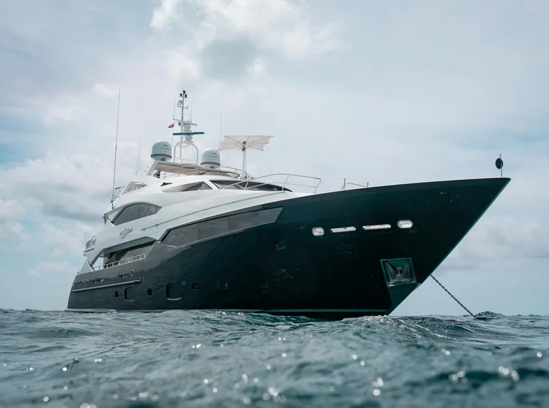 Slide: The Image of 2014 Sunseeker 131 yacht on open water under a cloudy sky. - 44