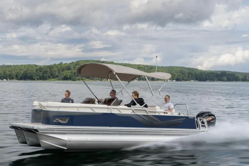 The Image of 2026 Tahoe Pontoon Sport 85 on a lake with passengers. - 1