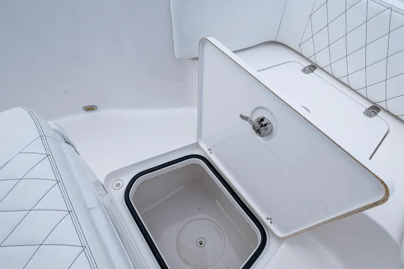 Slide: The Image of 2022 Blazer Bay 2700 Hybrid boat storage compartment with open lid. - 8