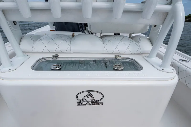 Slide: The Image of 2022 Blazer Bay 2700 Hybrid boat interior with livewell and seating. - 9