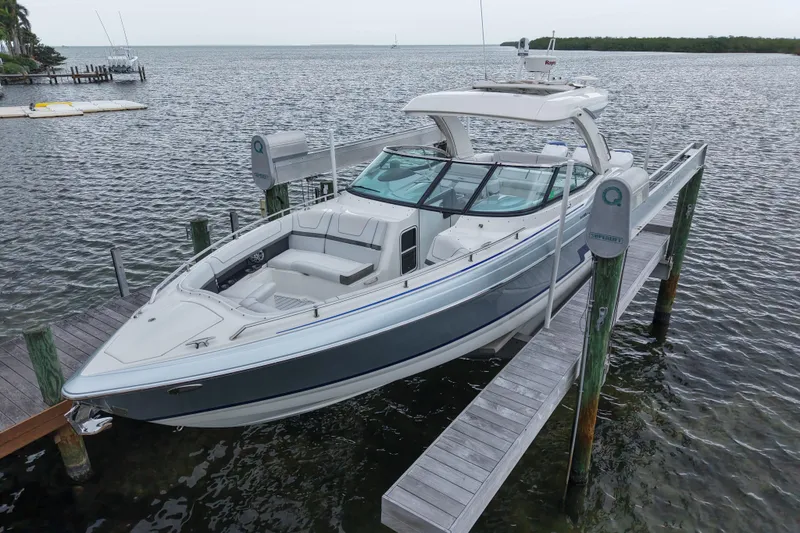 The Image of 2018 Formula 350 FX Crossover Bowrider docked on calm waters. - 1