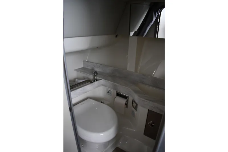 Slide: The Image of Interior of 2018 Formula 350 FX Crossover Bowrider bathroom with modern fixtures. - 16
