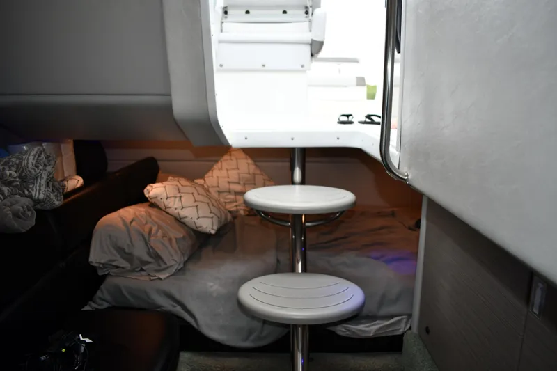 Slide: The Image of 2018 Formula 350 FX Crossover Bowrider cabin interior with cozy bedding and modern design. - 17