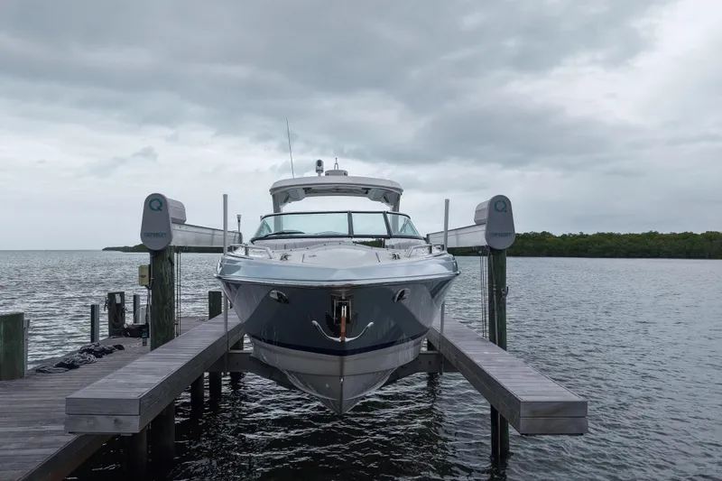 Slide: The Image of 2018 Formula 350 FX Crossover Bowrider docked on a cloudy day. - 4