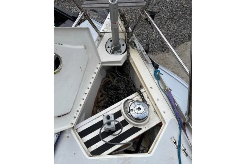 Slide: The Image of Anchor locker of a 1991 Hunter Legend 37.5 sailboat with winch and chain. - 11