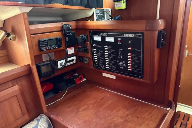 Slide: The Image of 1991 Hunter Legend 37.5 yacht interior with navigation and control panel. - 8