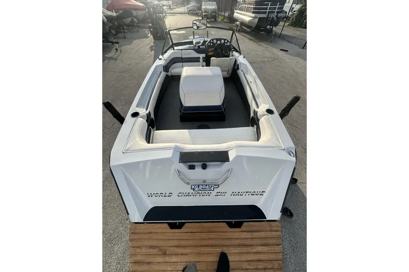 Slide: The Image of 1992 Correct Craft Ski Nautique boat, white interior, parked outdoors. - 10