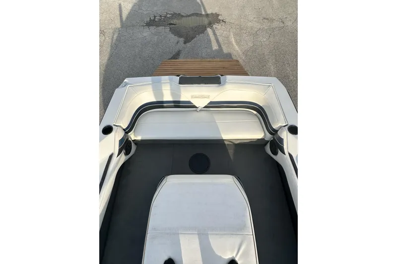 Slide: The Image of 1992 Correct Craft Ski Nautique boat interior with white seating and cup holders. - 14