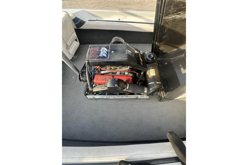Slide: The Image of 1992 Correct Craft Ski Nautique engine compartment with visible components and interior details. - 17