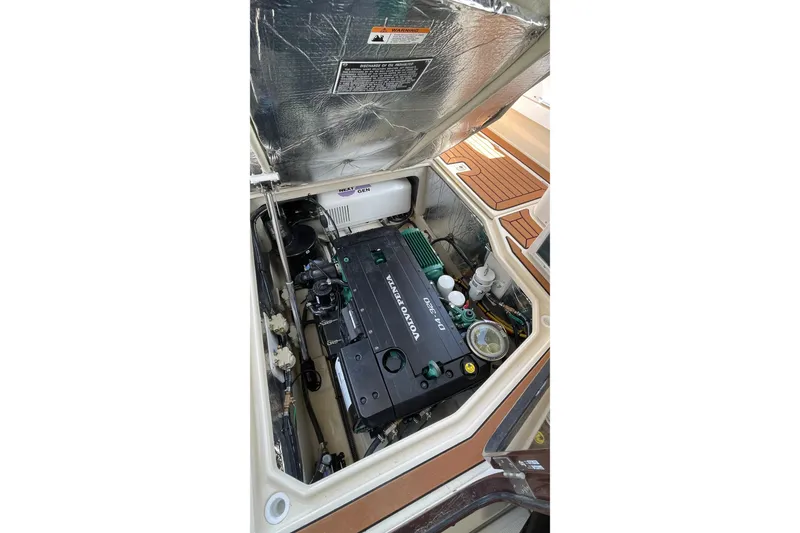 Slide: The Image of Engine compartment of 2025 Ranger Tugs R-31 S, featuring a Volvo Penta engine. - 22