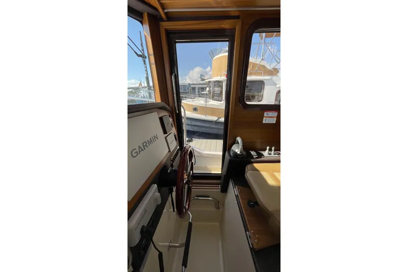 Slide: The Image of Interior view of 2025 Ranger Tugs R-31 S boat with Garmin navigation system. - 36
