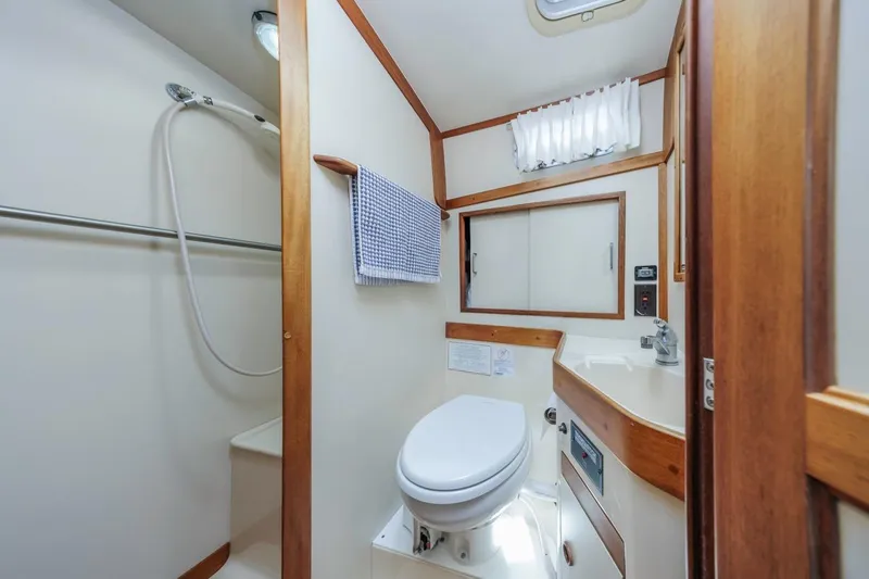 Slide: The Image of Bathroom interior of 2000 Sabre 34 Flybridge yacht with shower and toilet. - 33
