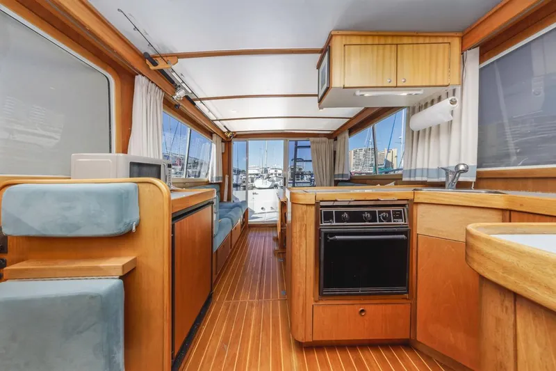 Slide: The Image of Interior of 2000 Sabre 34 Flybridge yacht with wood finish and modern amenities. - 36