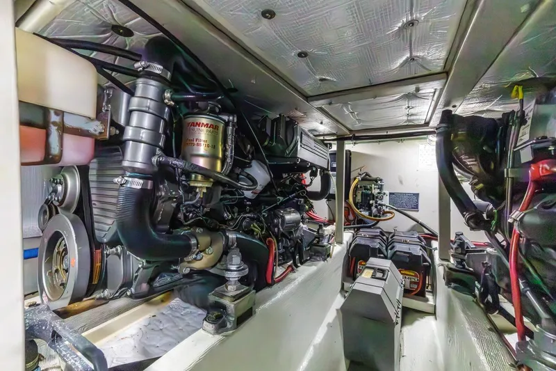Slide: The Image of Engine room of 2000 Sabre 34 Flybridge with Yanmar components and batteries. - 41