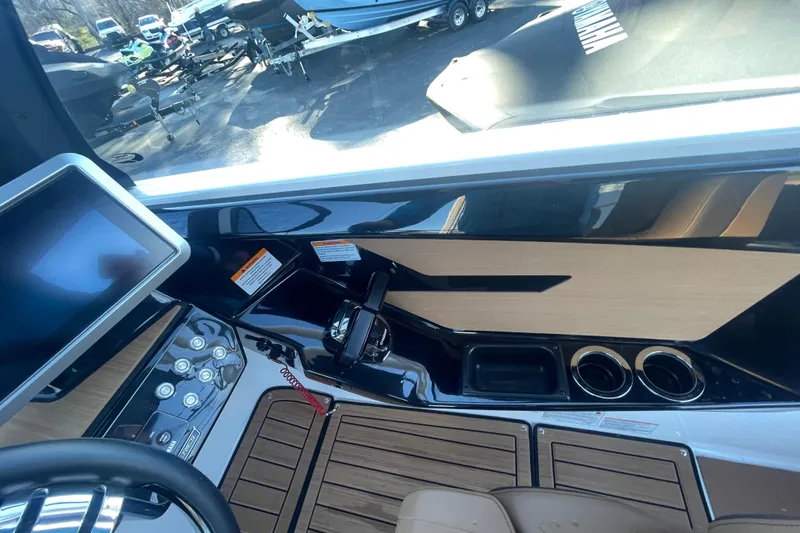 Slide: The Image of 2025 Yamaha Boats 222SD dashboard with modern controls and sleek design. - 10