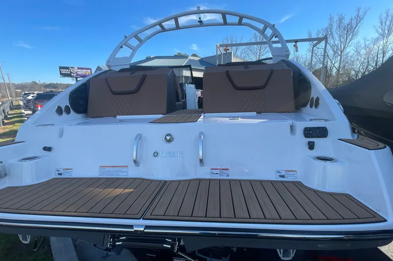 Slide: The Image of 2025 Yamaha Boats 222SD rear view, showcasing sleek design and spacious deck. - 3