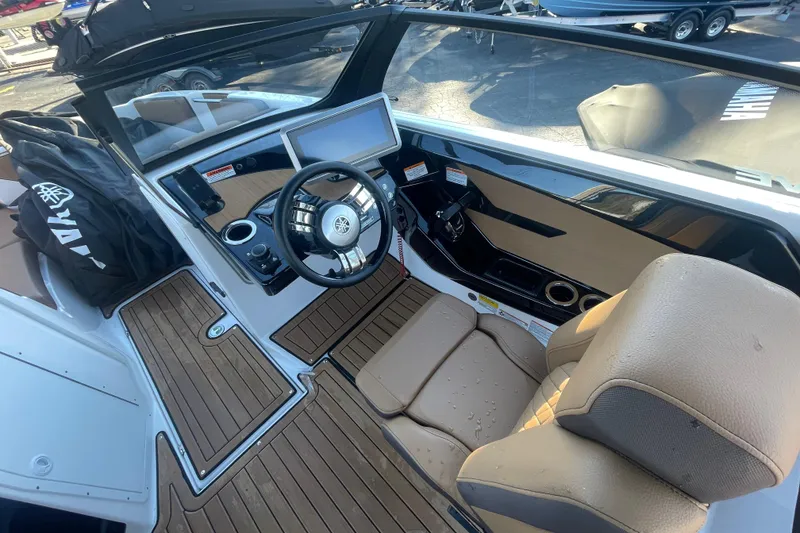 Slide: The Image of 2025 Yamaha Boats 222SD cockpit with modern steering and dashboard design. - 8