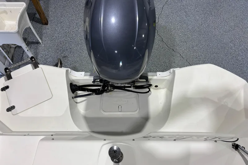 Slide: The Image of 2015 NauticStar 223DC Sport Deck boat with outboard motor, viewed from above. - 17