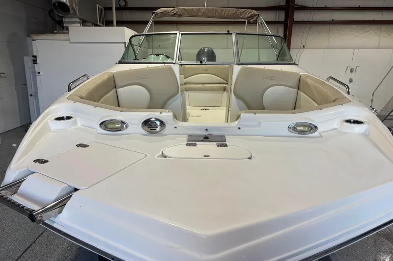 Slide: The Image of 2015 NauticStar 223DC Sport Deck boat with spacious seating and sleek design. - 4