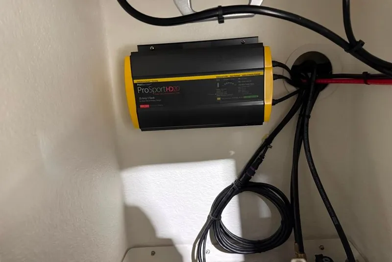 Slide: The Image of Battery charger in 2024 Parker 2820 XLD Sport Cabin boat, mounted with cables. - 14