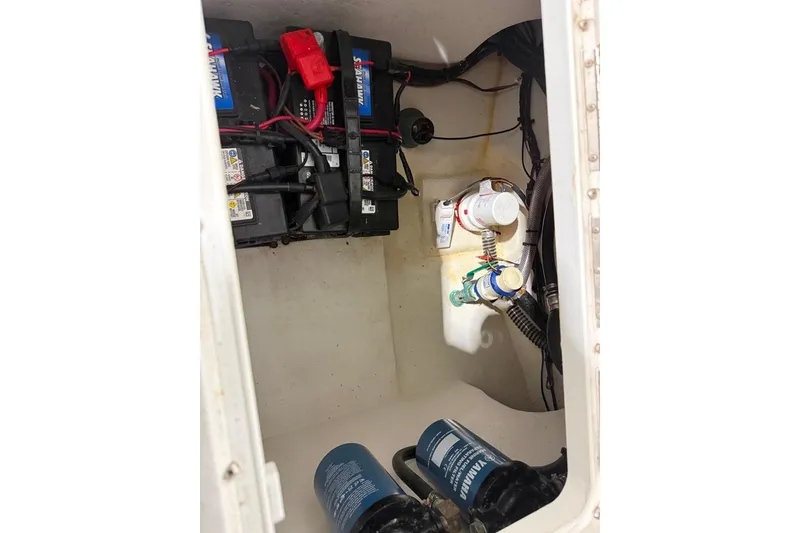 Slide: The Image of 2024 Parker 2820 XLD Sport Cabin battery compartment with wiring and components. - 17