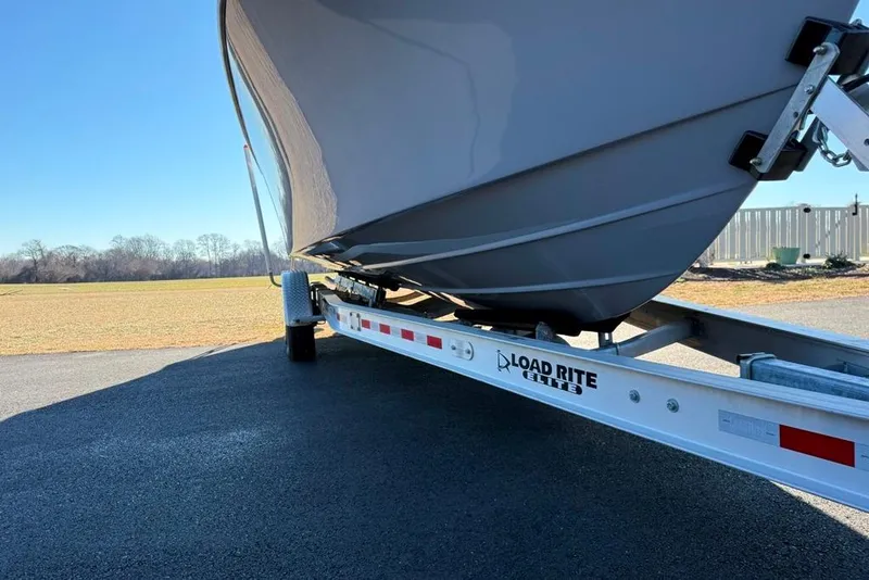 Slide: The Image of 2024 Parker 2820 XLD Sport Cabin boat on Load Rite Elite trailer. - 3