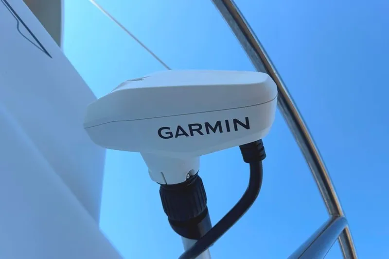 Slide: The Image of Garmin device on 2024 Parker 2820 XLD Sport Cabin boat against blue sky. - 6