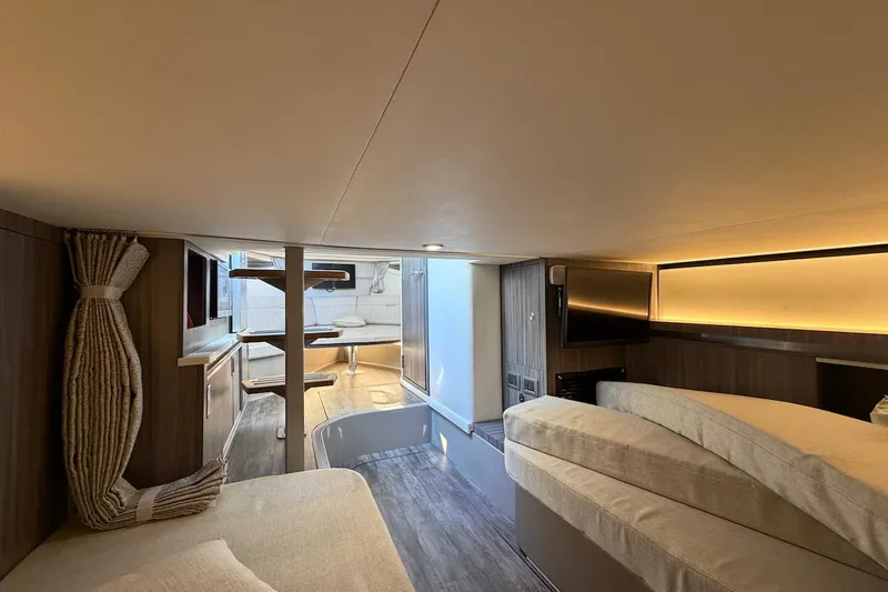 Slide: The Image of Luxurious interior of 2023 Sea Ray Sundancer 320 Outboard, featuring cozy seating and modern amenities. - 30