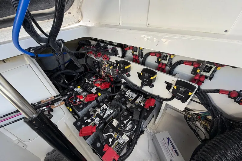 Slide: The Image of Electrical system of 2023 Sea Ray Sundancer 320 Outboard, showcasing batteries and wiring. - 37