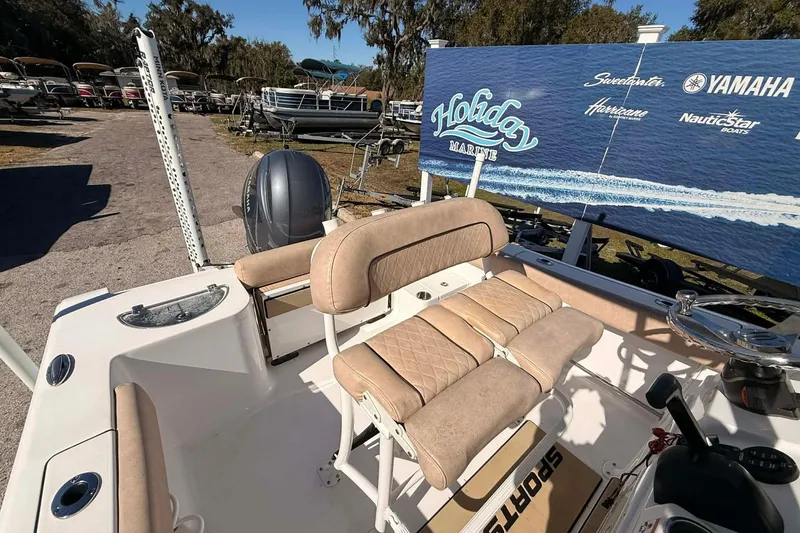 Slide: The Image of 2019 Sportsman Open 212 Center Console boat interior with seating and controls. - 2