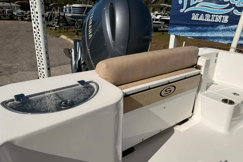 Slide: The Image of 2019 Sportsman Open 212 Center Console boat with Yamaha engine, rear seating, and storage. - 3