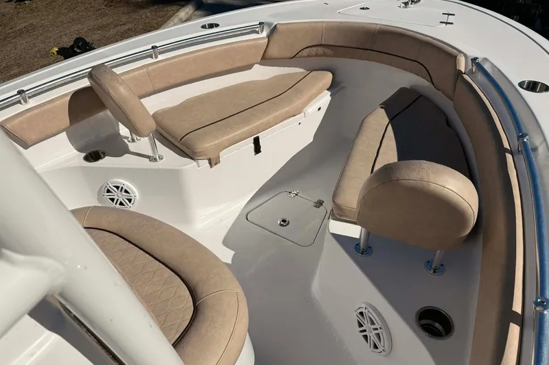 Slide: The Image of 2019 Sportsman Open 212 Center Console boat with beige cushioned seating. - 5