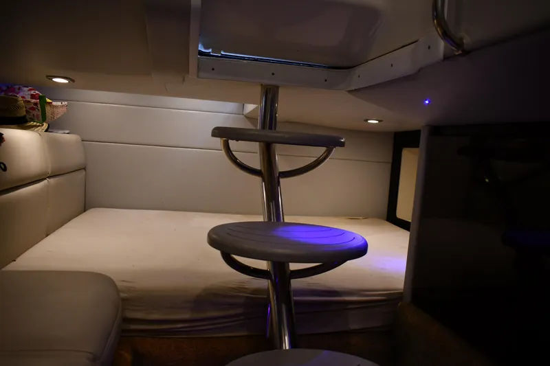 Slide: The Image of 2018 Formula 350 Crossover Bowrider OB cabin interior with cozy seating and ambient lighting. - 12