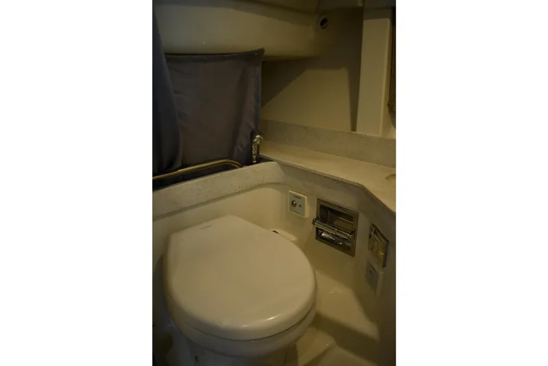 Slide: The Image of 2018 Formula 350 Crossover Bowrider OB bathroom interior with toilet and countertop. - 14