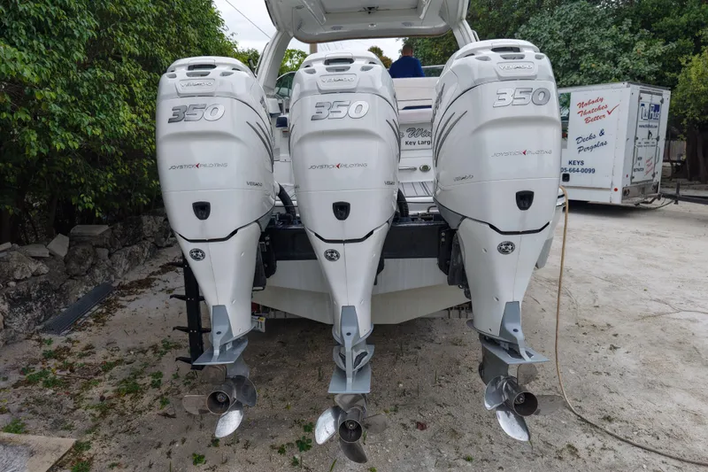 Slide: The Image of Triple outboard engines on a 2018 Formula 350 Crossover Bowrider OB boat. - 8