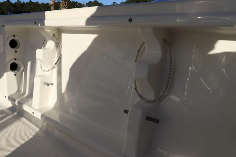 Slide: The Image of 2016 Sea Born FX21 Bay boat interior detail with rod holders and storage compartments. - 10