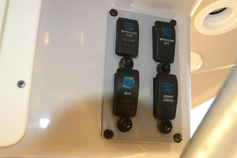 Slide: The Image of Control panel on a 2016 Sea Born FX21 Bay boat with labeled switches. - 14