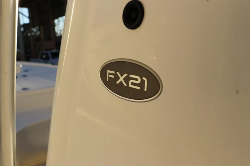 Slide: The Image of 2016 Sea Born FX21 Bay boat emblem in close-up view. - 17