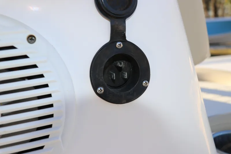 Slide: The Image of Close-up of a 2016 Sea Born FX21 Bay boat's electrical outlet and speaker. - 19