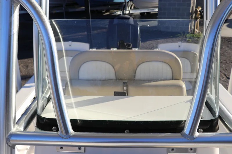 Slide: The Image of 2016 Sea Born FX21 Bay boat interior with windshield and seating. - 21