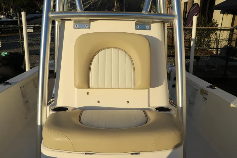 Slide: The Image of 2016 Sea Born FX21 Bay boat seating area with beige and white upholstery. - 22