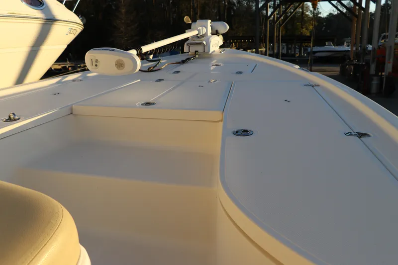 Slide: The Image of 2016 Sea Born FX21 Bay boat deck with storage compartments and trolling motor. - 24