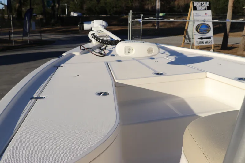 Slide: The Image of 2016 Sea Born FX21 Bay boat deck with trolling motor, showcased at a boat sale. - 26