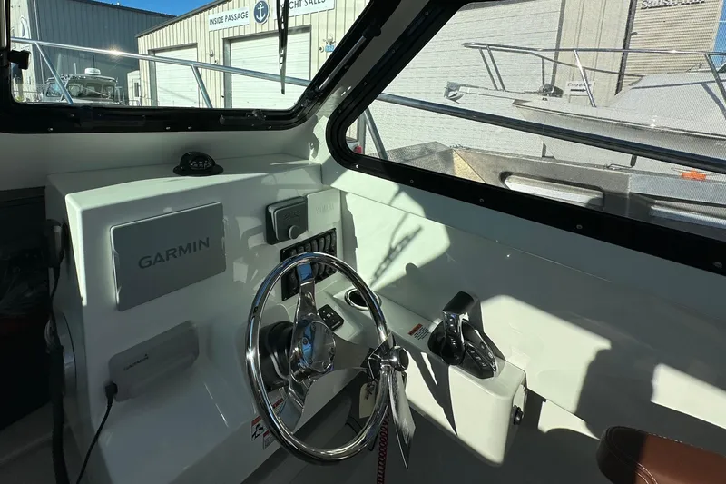 Slide: The Image of Interior of 2026 Parker 227 Explorer boat with Garmin navigation system. - 14
