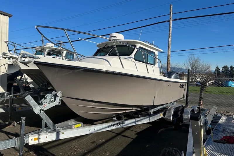 The Image of 2026 Parker 227 Explorer boat on trailer under clear blue sky. - 6