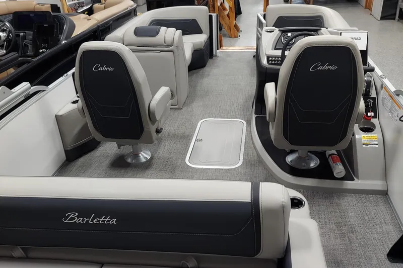 Slide: The Image of Interior of 2026 Barletta Cabrio 22UC pontoon boat, featuring luxurious seating and modern design. - 6