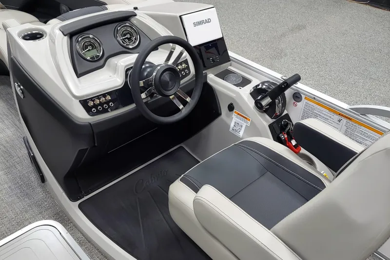 Slide: The Image of 2026 Barletta Cabrio 22UC boat dashboard with steering wheel and control panel. - 7